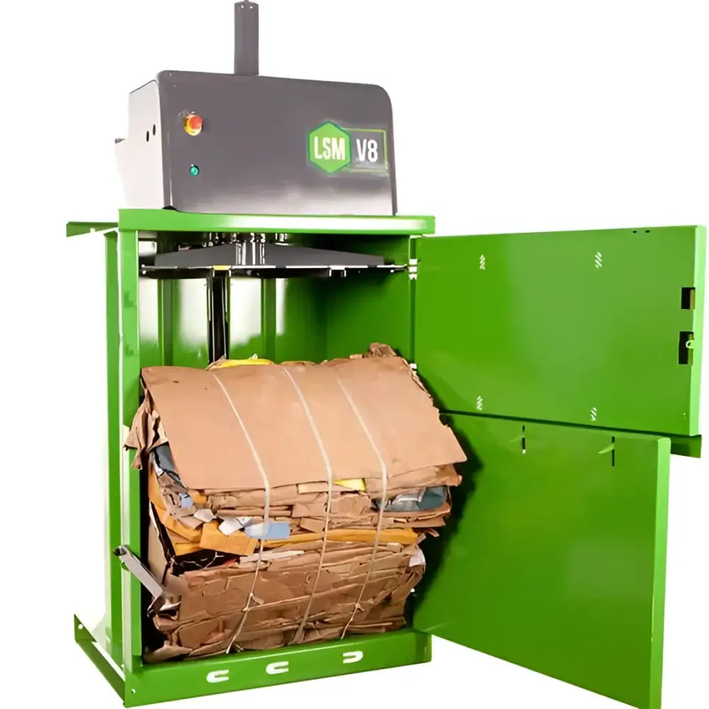 Green cardboard baler with open door for warehouse waste management and retail waste disposal